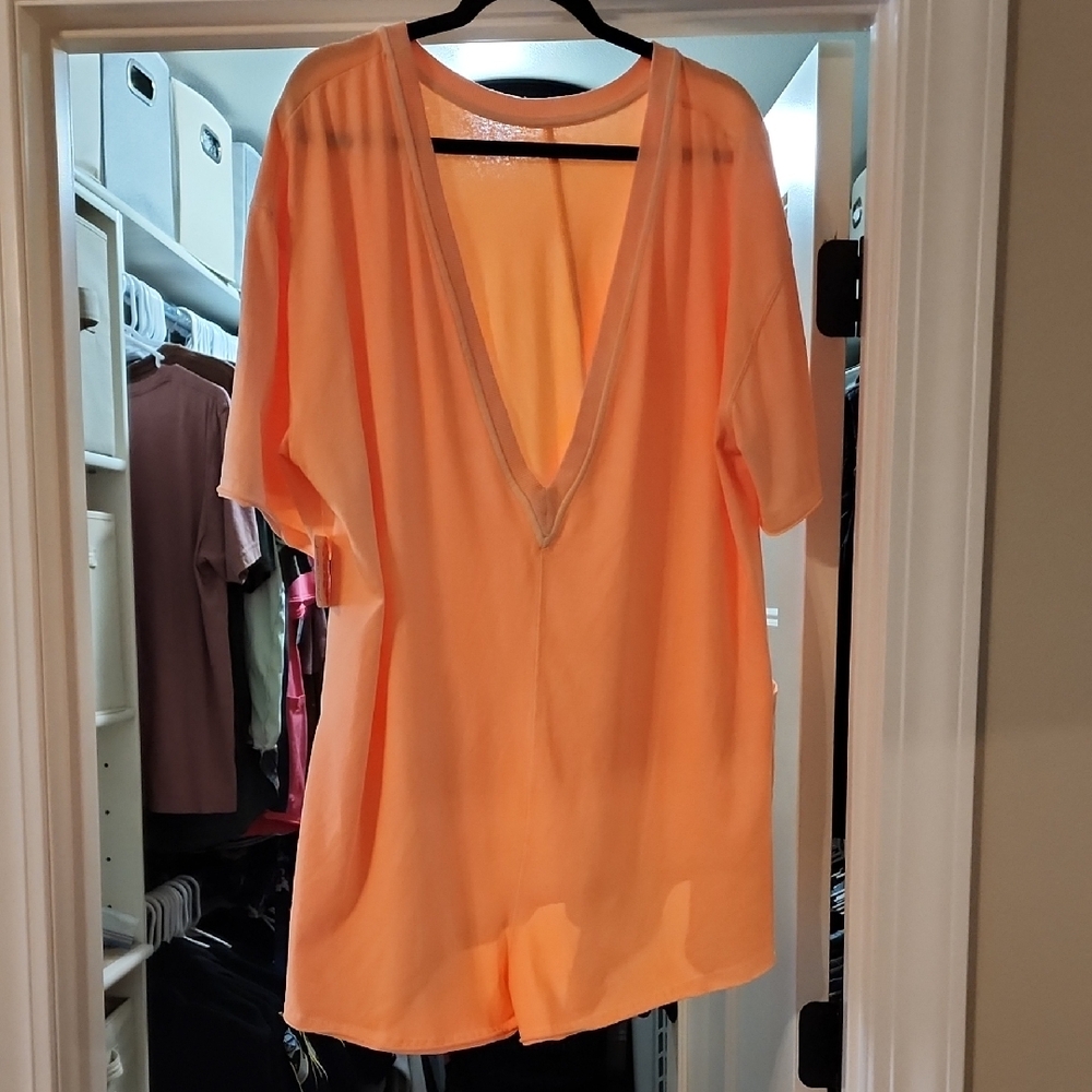 Free People Orange V-Neck Jumpsuit Flowing Silhouette